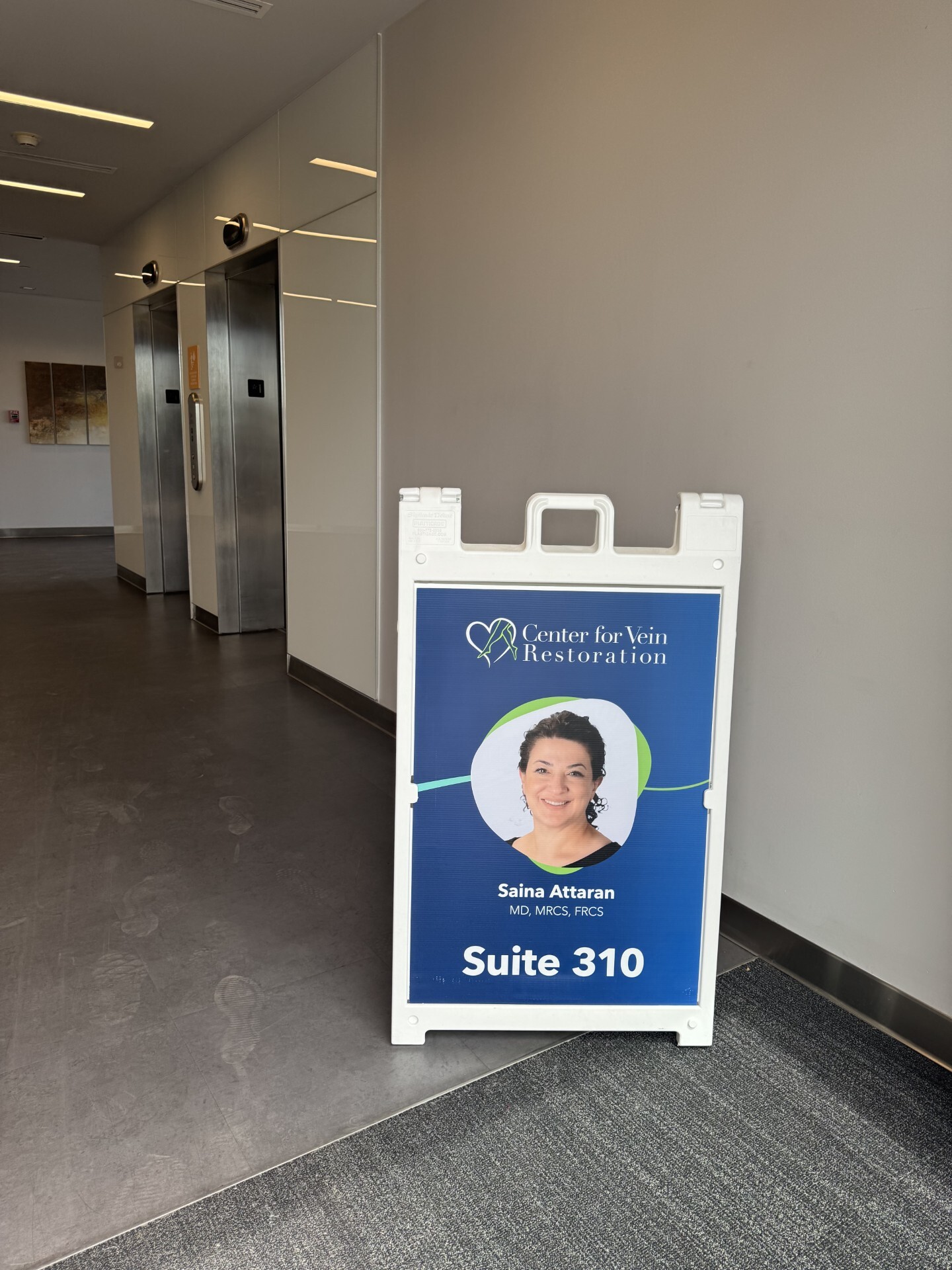 Exterior photo of the Mesa, AZ Center for Vein Restoration showing the welcome poster board