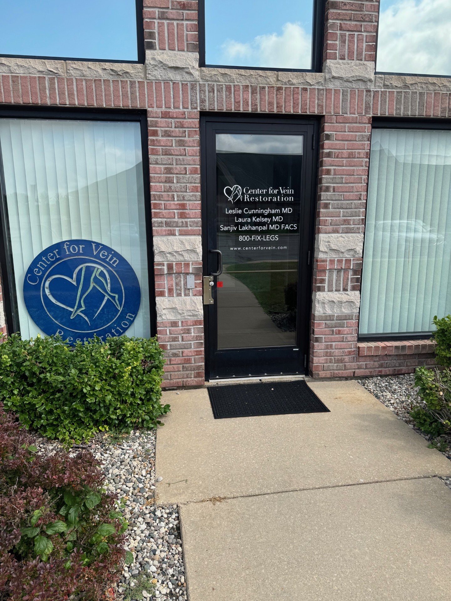 Exterior photo of the Saginaw, MI location of Center for Vein Restoration showing the front door