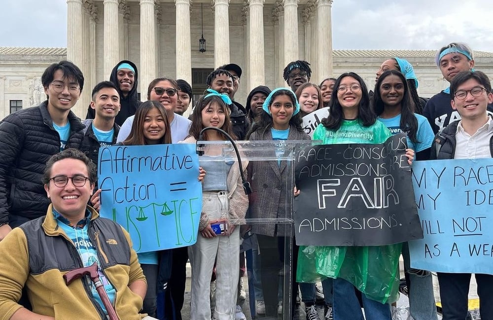 Students from across the country hold a press conference advocating for race-conscious admissions outside the Supreme Court in 2022