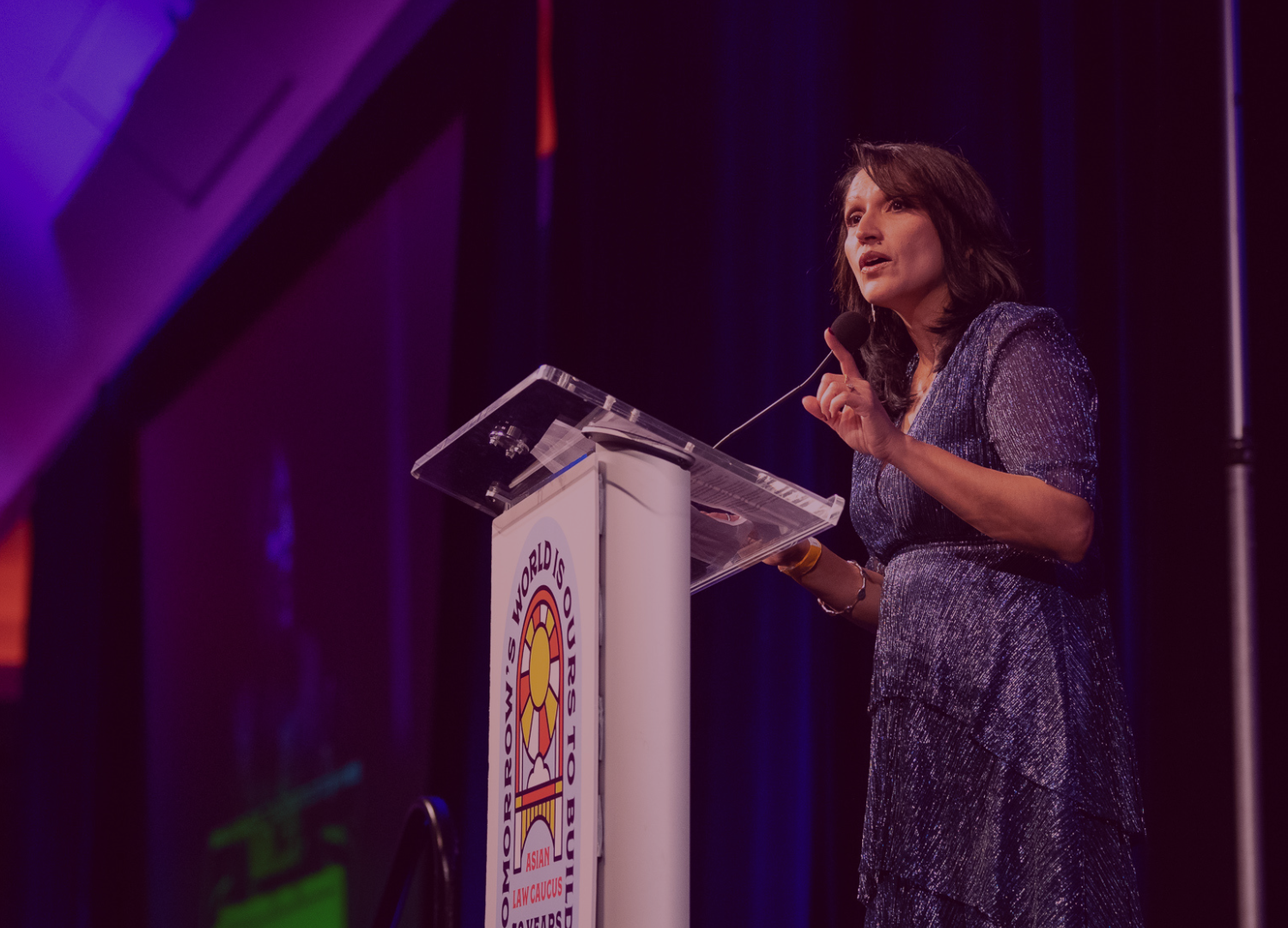 ALC Executive Director Aarti Kohli addresses the audience of supporters at a podium at the 50th Anniversary Gala.