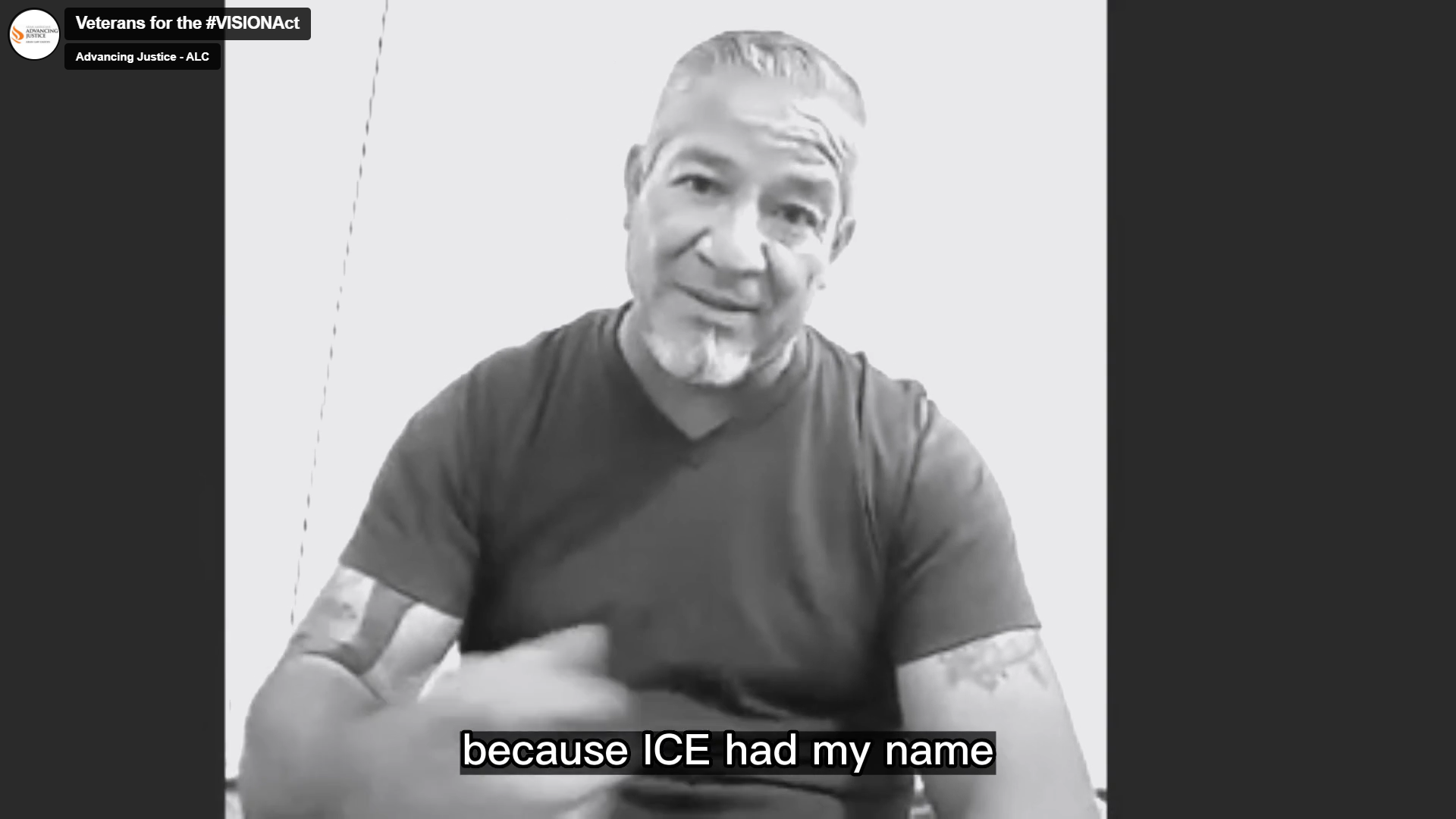 A video still of a veteran man with white hair and black T-shirt