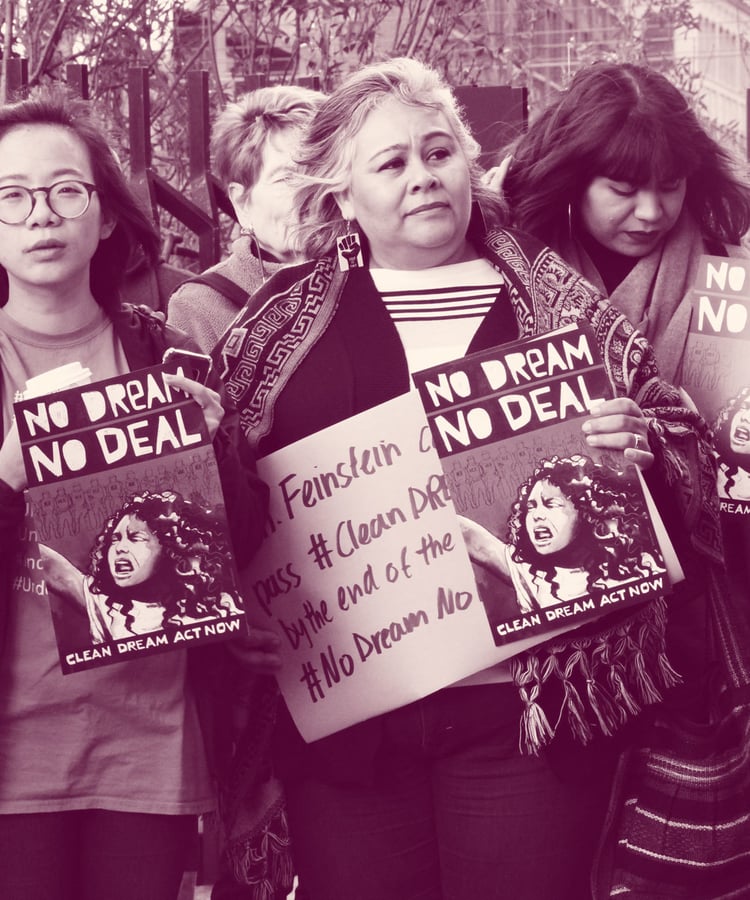 Group of seven people hold signs reading "no dream no deal"