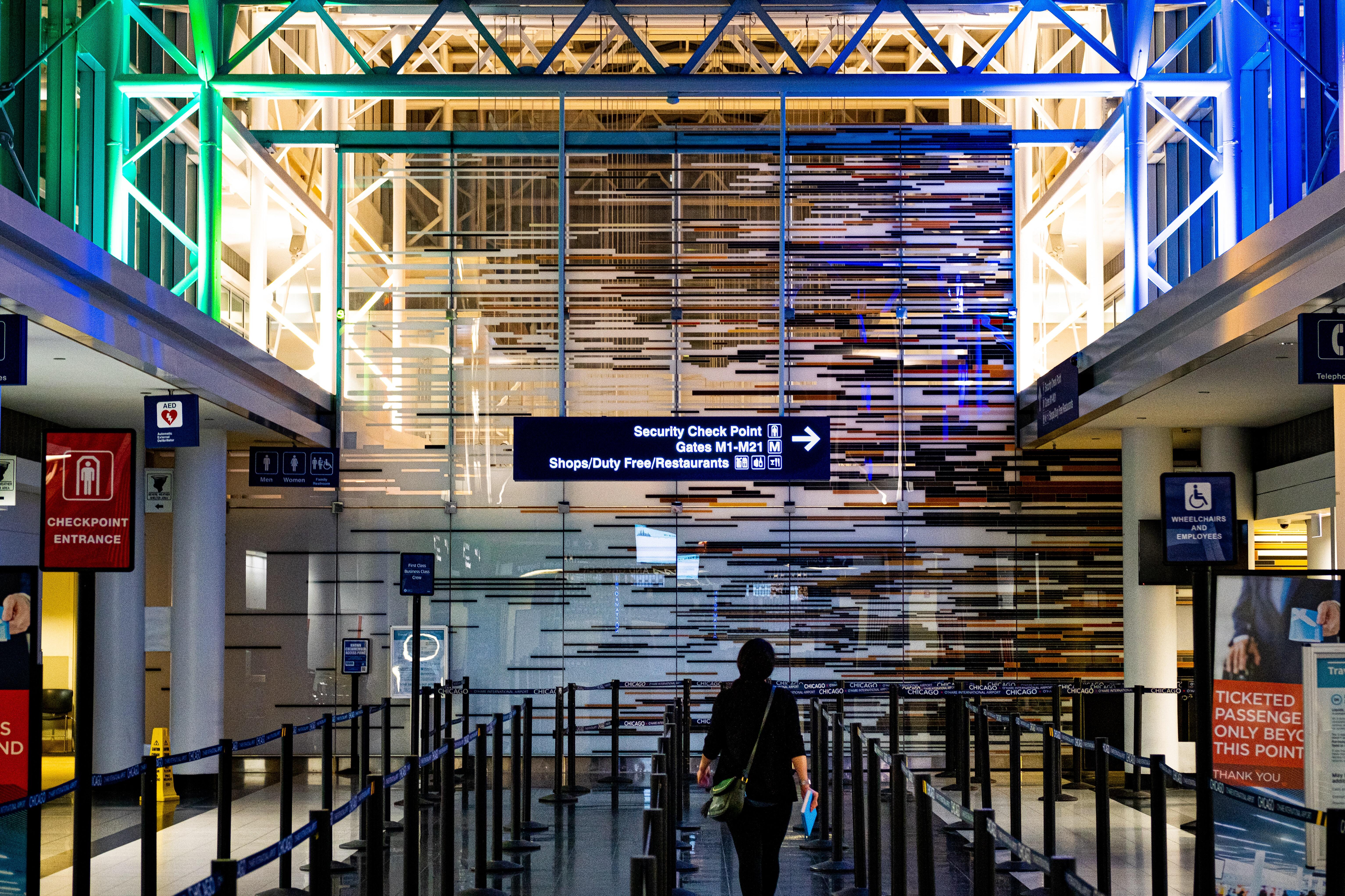 Person Standing Inside Building of Airport