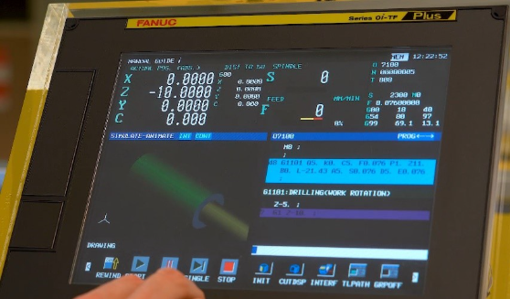 A hand touching a computer screen Description automatically generated