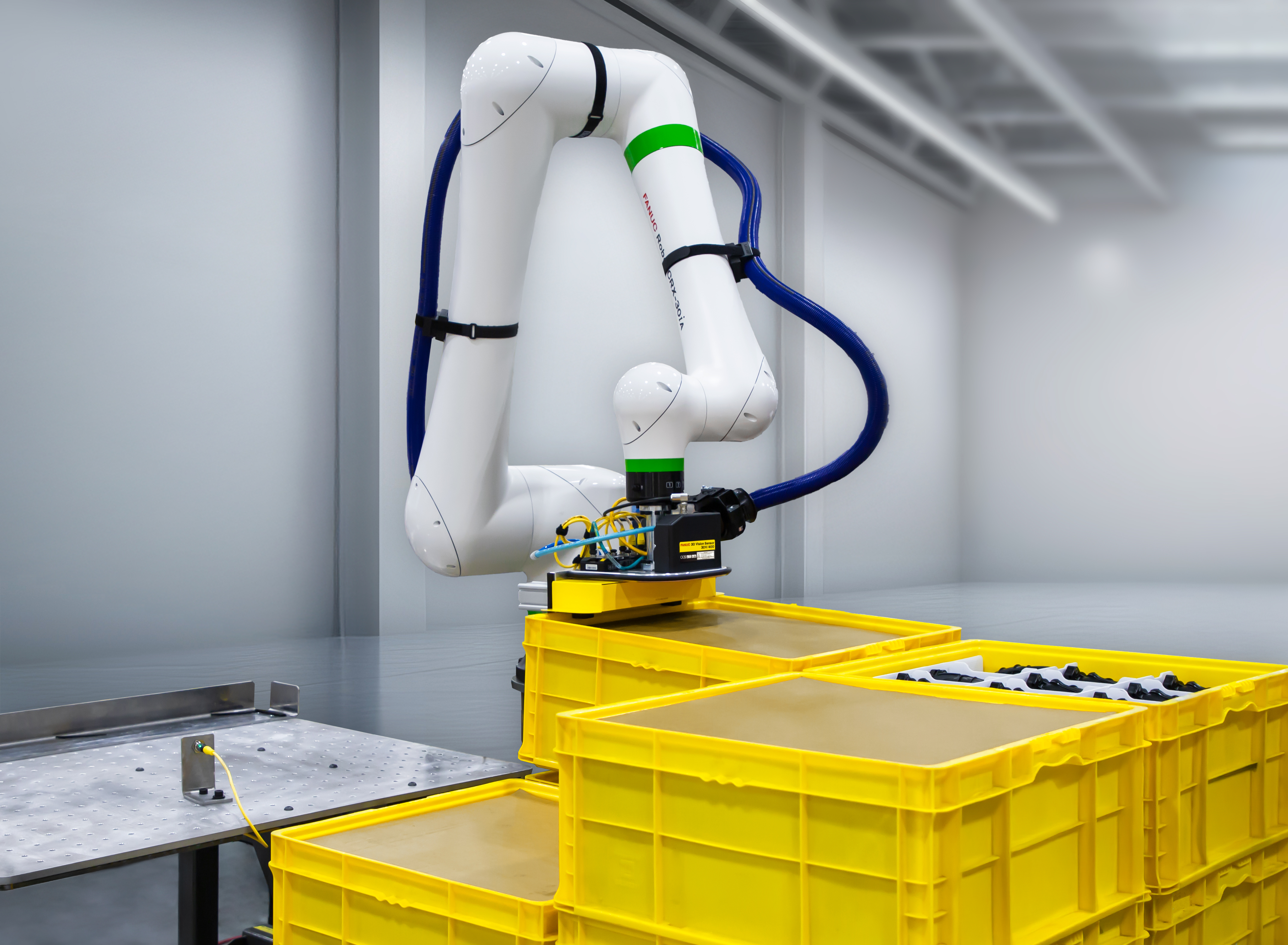 FANUC CRX-30iA handling bins of automotive parts