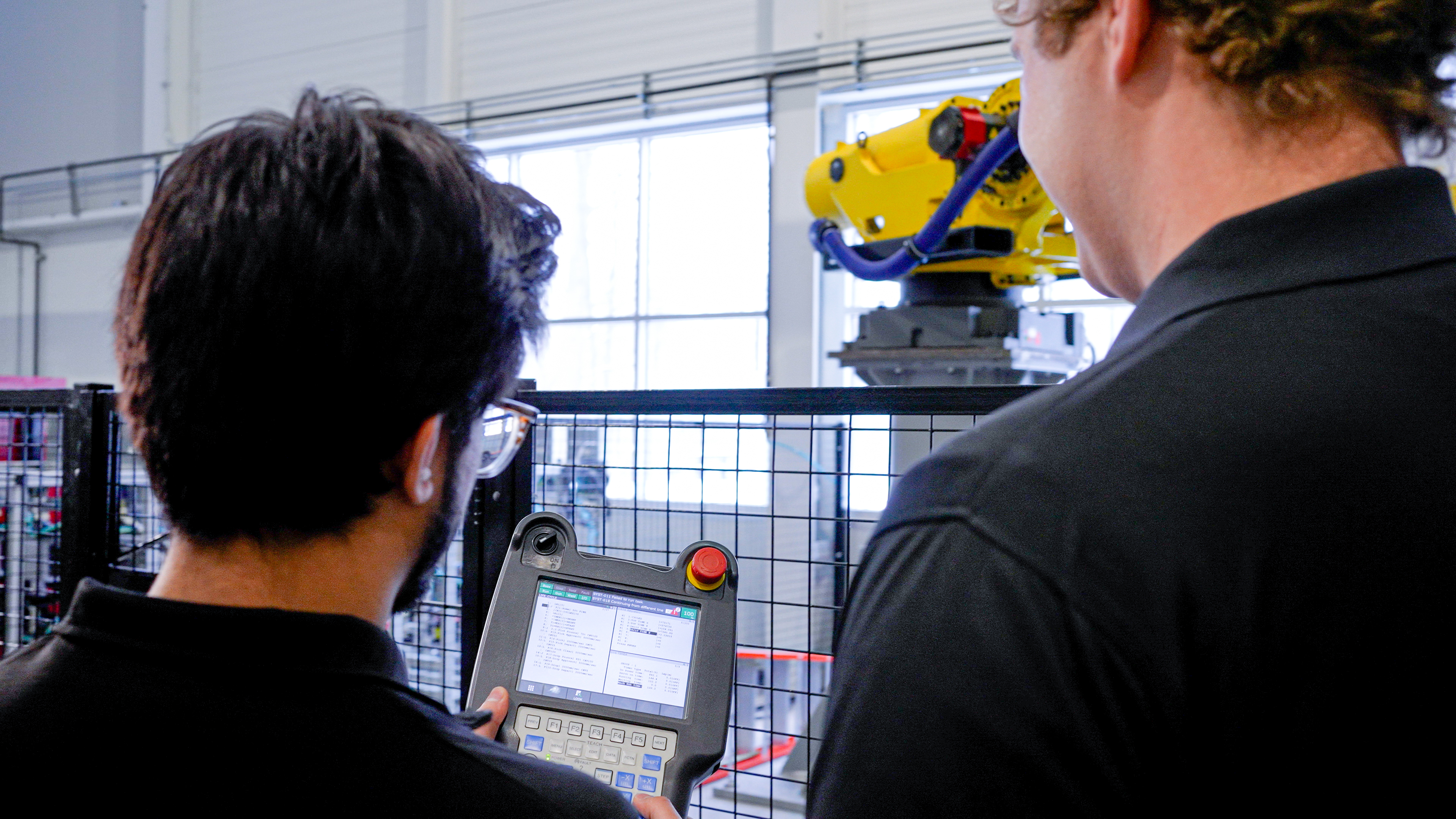 FANUC Employees Programming Robot Research and Development
