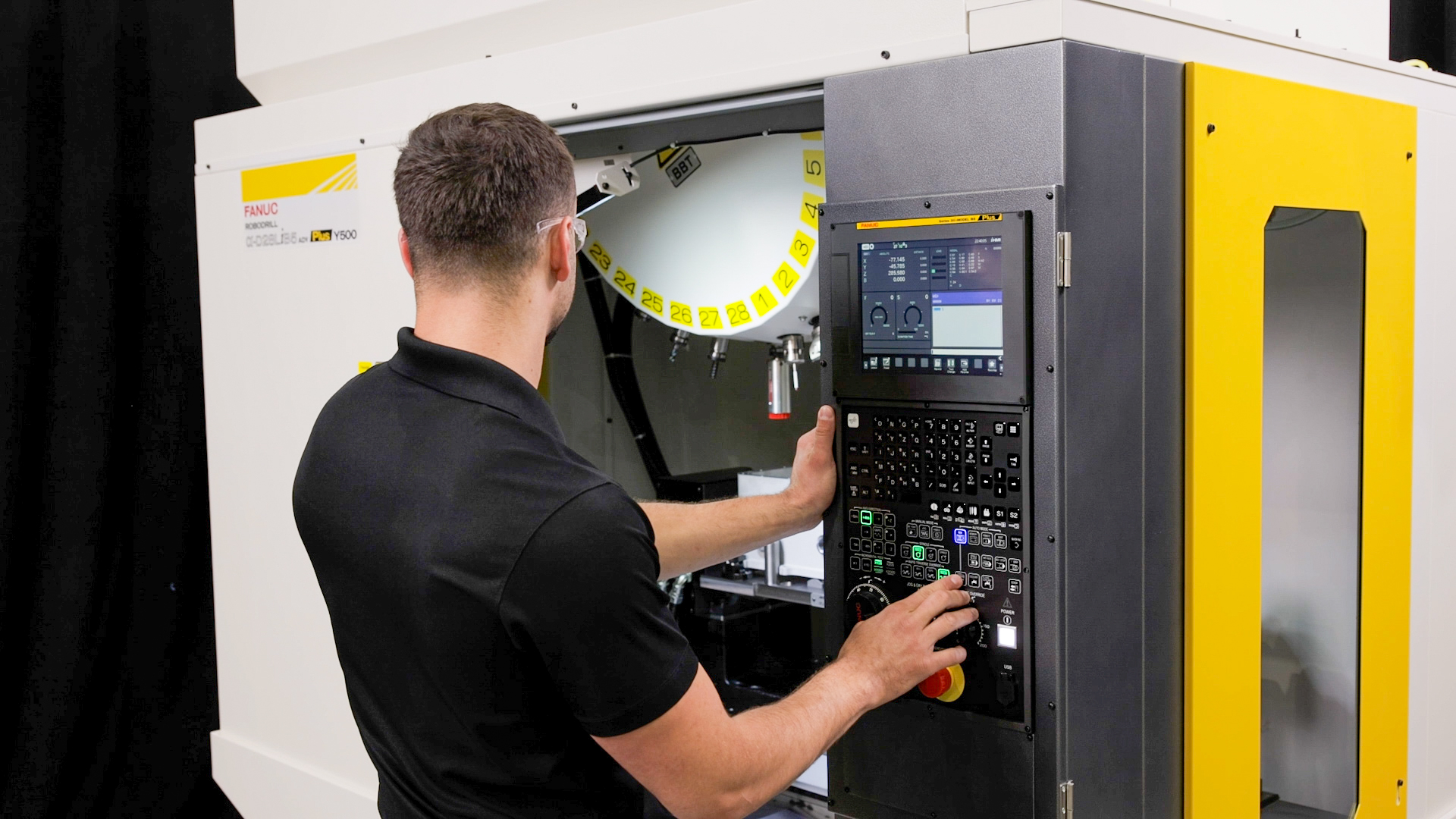 Technician Operating the ROBODRILL Plus α D28 Li B5 ADV Plus Y500