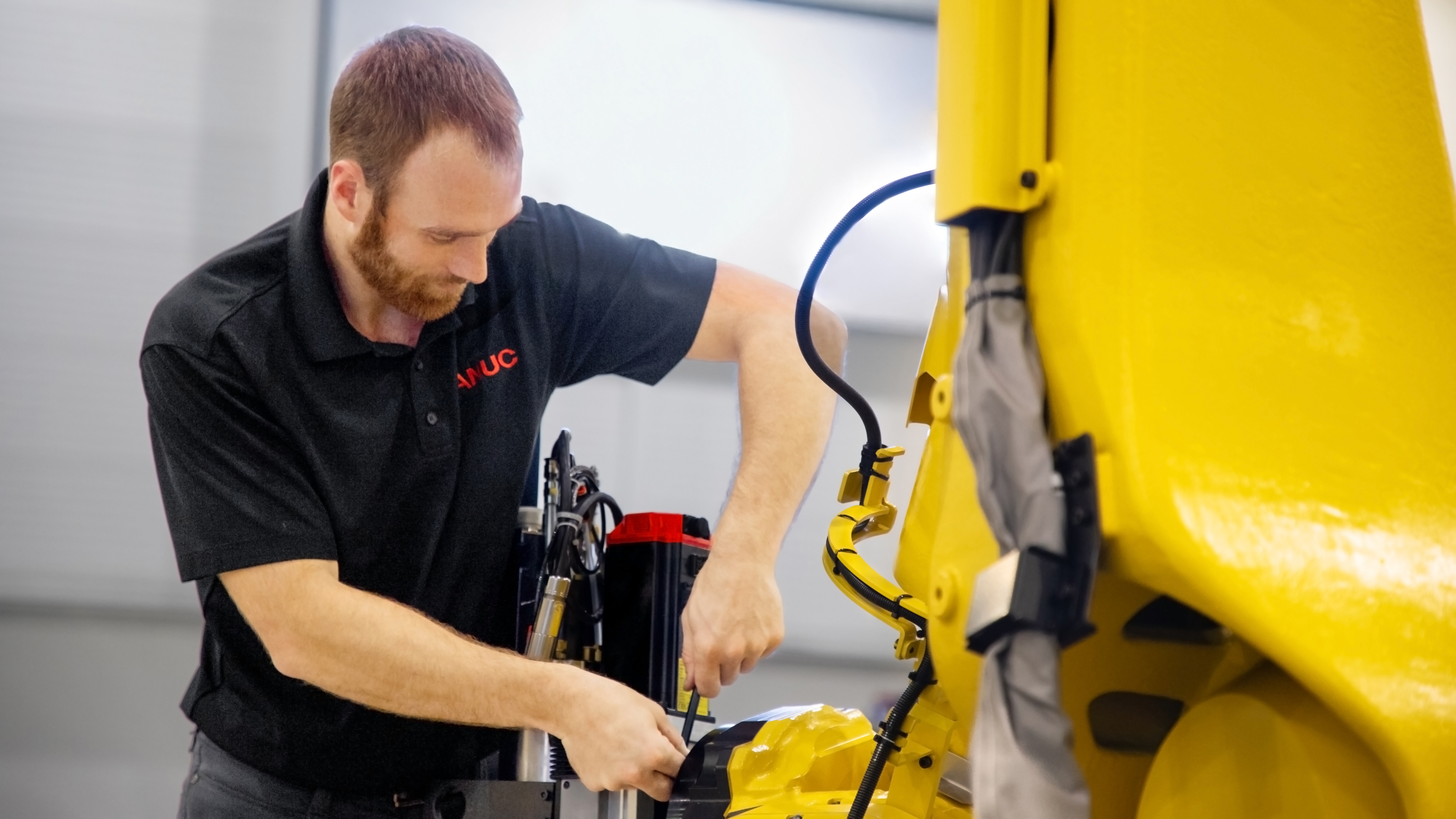 Employee Installing Endof Arm Tool M810