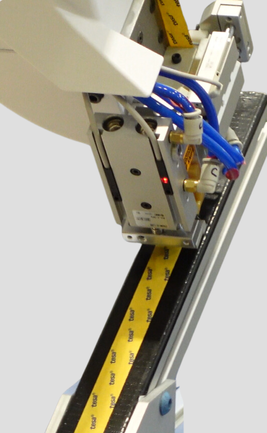 Robot tape applicator close up