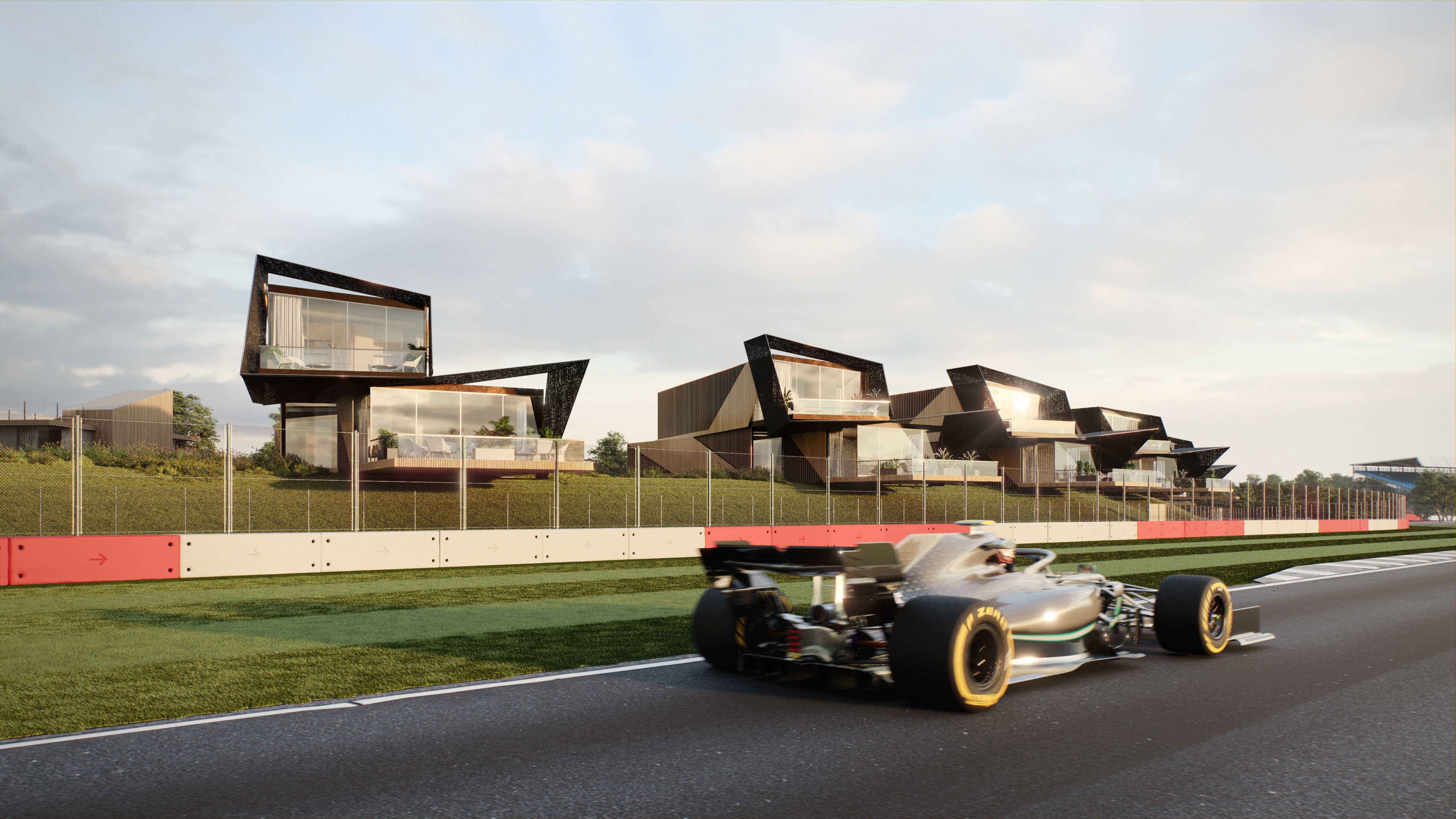 Formula One car on race track with modern angular buildings featuring glass and dark metal facades in background under cloudy sky.