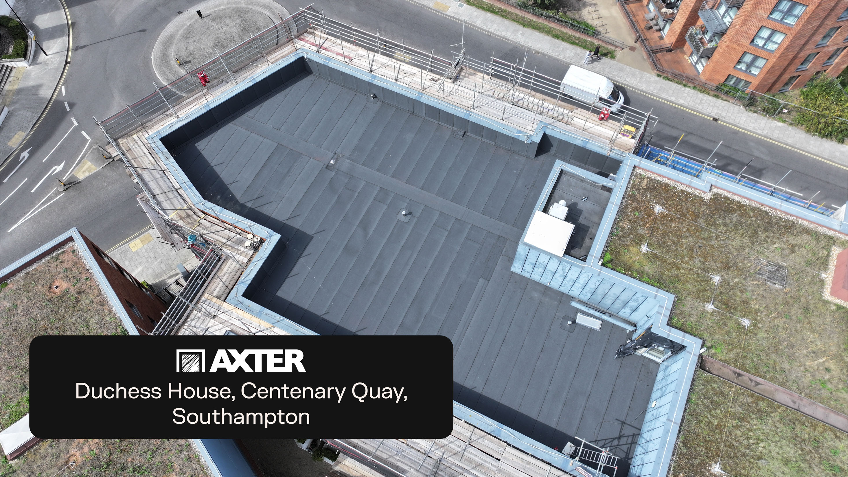 Aerial view of modern building with dark flat roof, a residential buildings in Southampton.