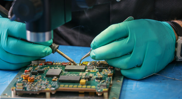 VPT employee working (gloved) on an SGRB unit