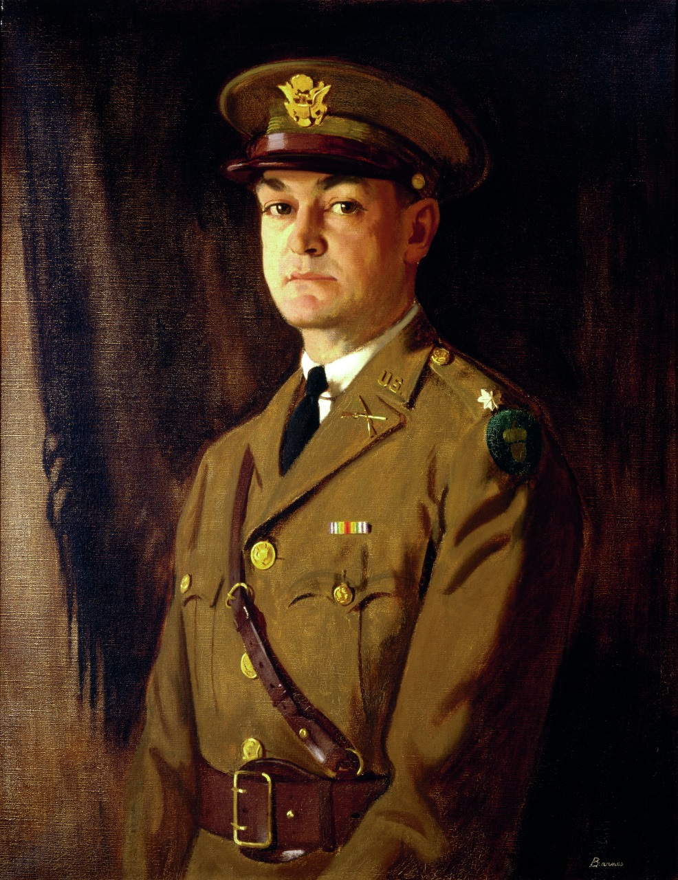 Portrait of a military officer in uniform with a serious expression, wearing a peaked cap and a brown coat adorned with badges and insignia. The background is dark, giving the image a formal and historical tone.