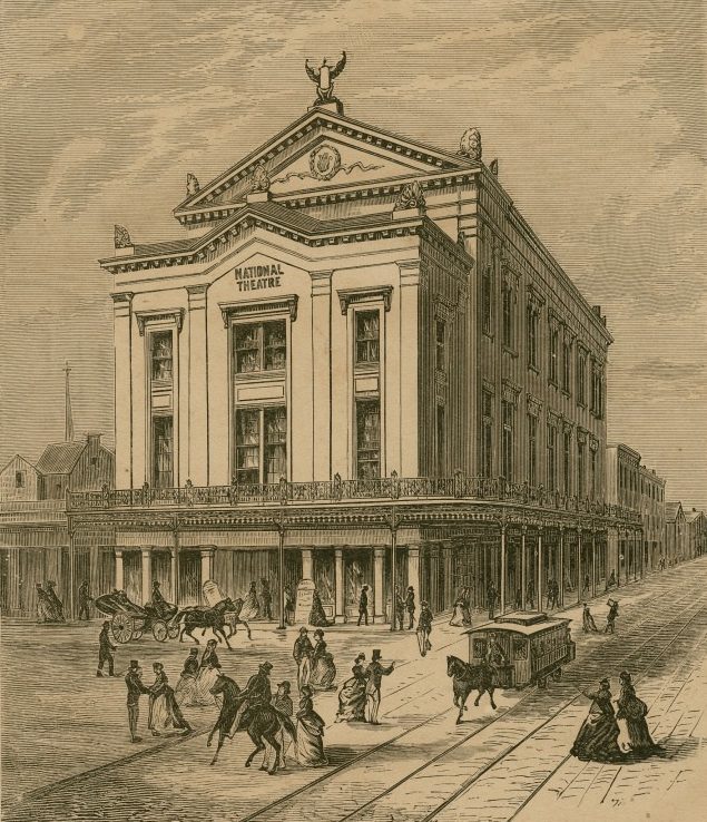 An old engraving of a bustling street scene in front of a historical theater building labeled National Theatre. People walk along the sidewalk, while horses and carriages move on the street. The architecture is ornate and classical.