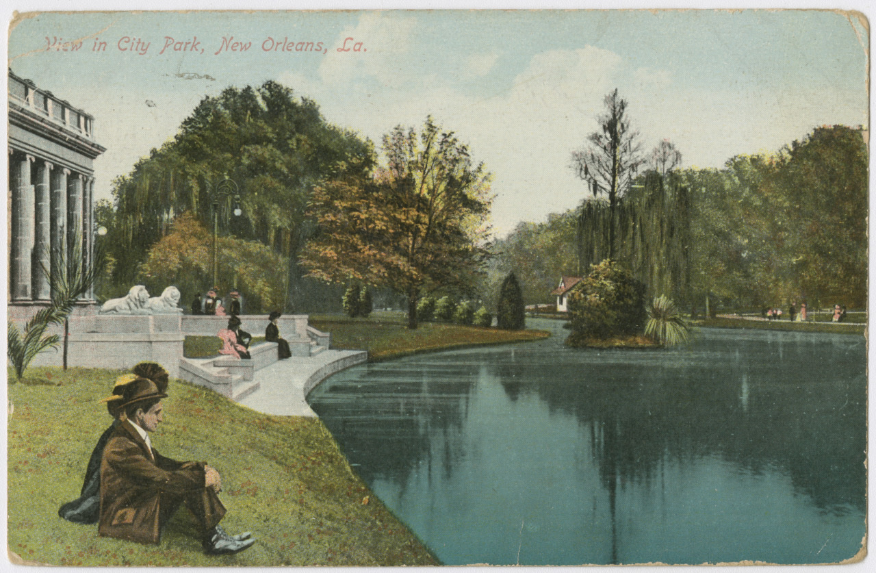 Vintage postcard showing people relaxing by a pond in City Park, New Orleans. The scene includes a neoclassical building, trees, and people sitting on steps and grass.
