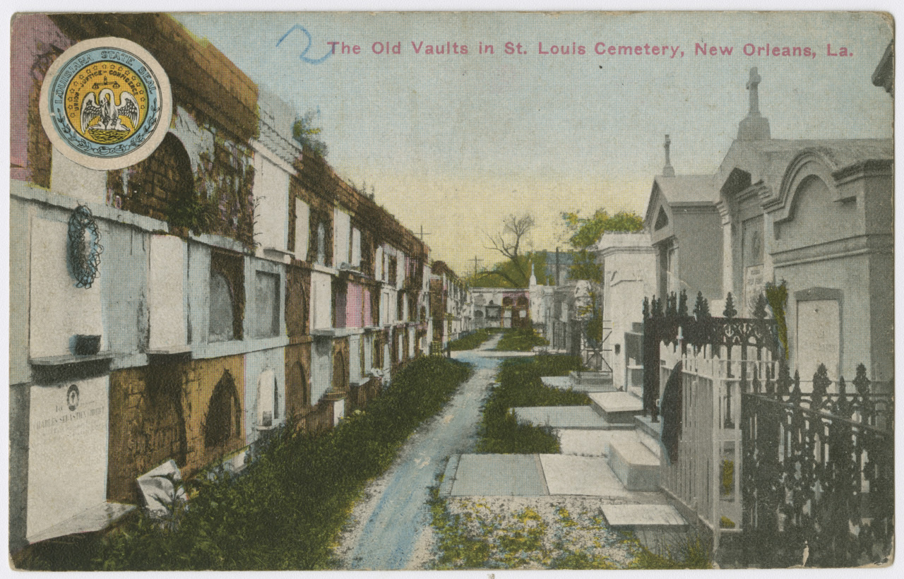 A vintage postcard depicting the old vaults in St. Louis Cemetery, New Orleans, Louisiana. The cemetery features above-ground tombs and a narrow, grassy path flanked by ornate gravestones and vaults. The sky is overcast, adding to the scenes historic feel.