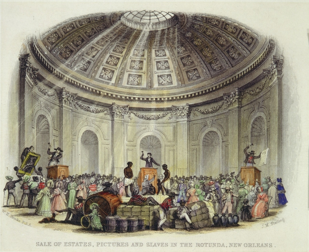 A historic illustration of a rotunda in New Orleans, depicting an auction scene. People gather around, some on platforms, with various goods like pictures and bales visible. The dome above is intricately detailed with sunlight streaming in.