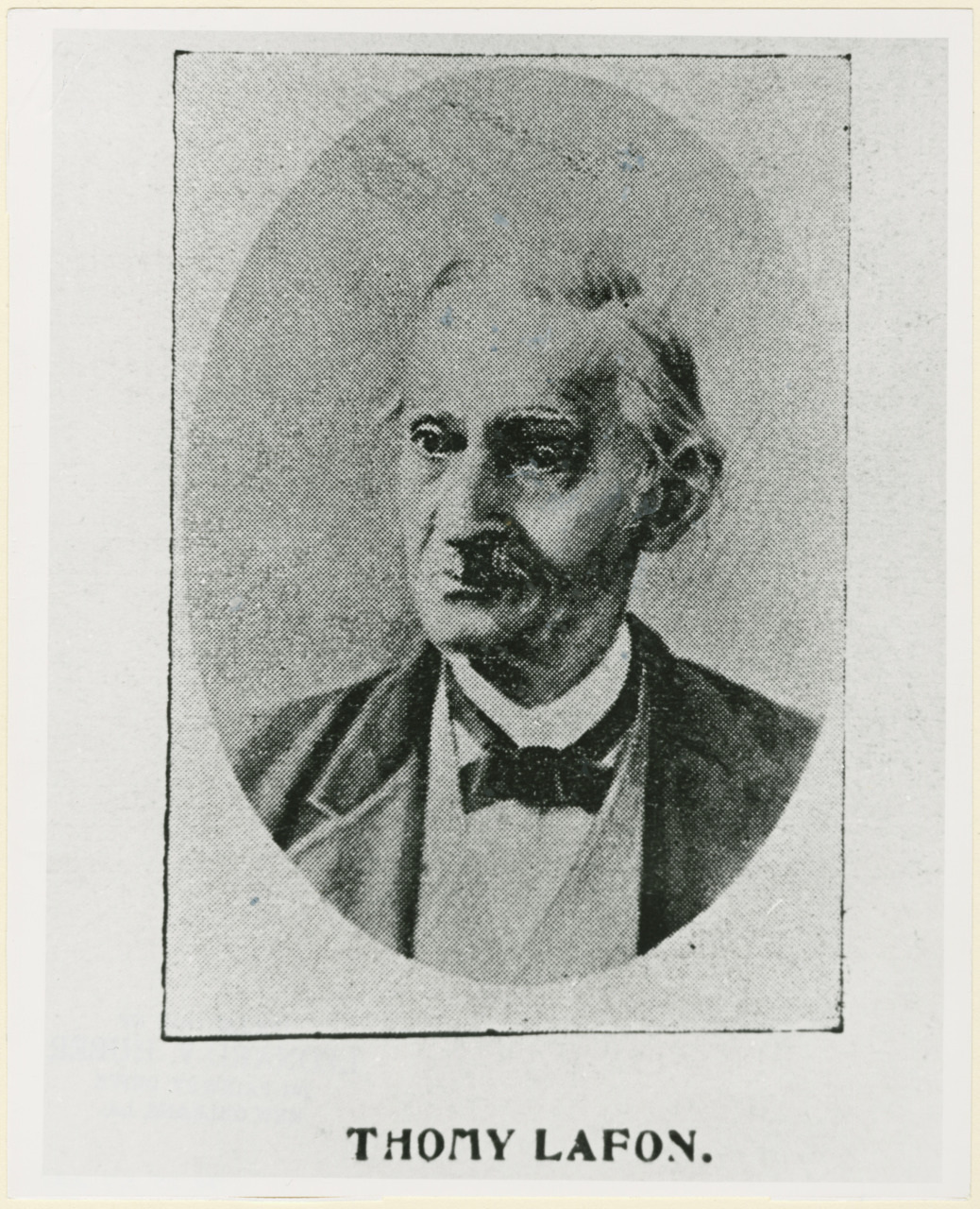 Black and white portrait of an older man in a suit and bow tie. His hair is combed back, and he has a neutral expression. Below the image is the text Thomy Lafon.