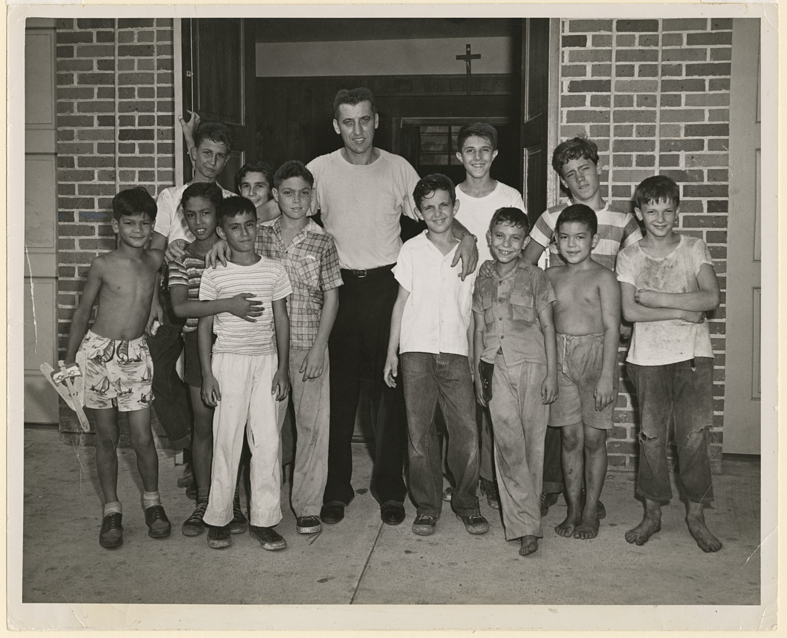 Father Vincent and a group of boys stand outside St. Mary’s Catholic Church in the French Quarter, between 1945 and 1950.