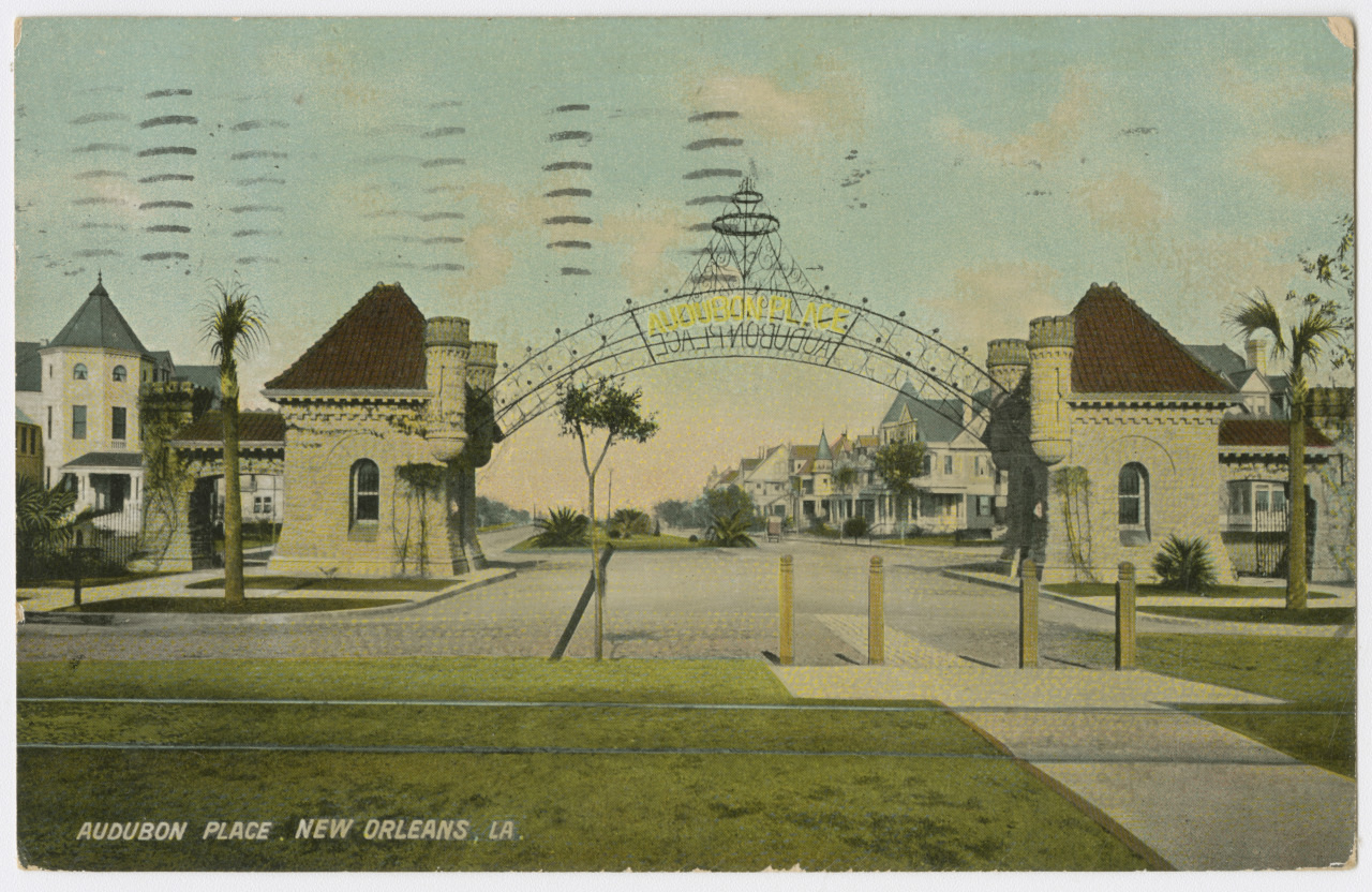 Vintage postcard of Audubon Place in New Orleans, featuring a grand entrance with two stone gatehouses and an ornate wrought-iron archway. Lined with trees and elegant houses, the street is depicted in a pastel color palette, evoking a nostalgic feel.