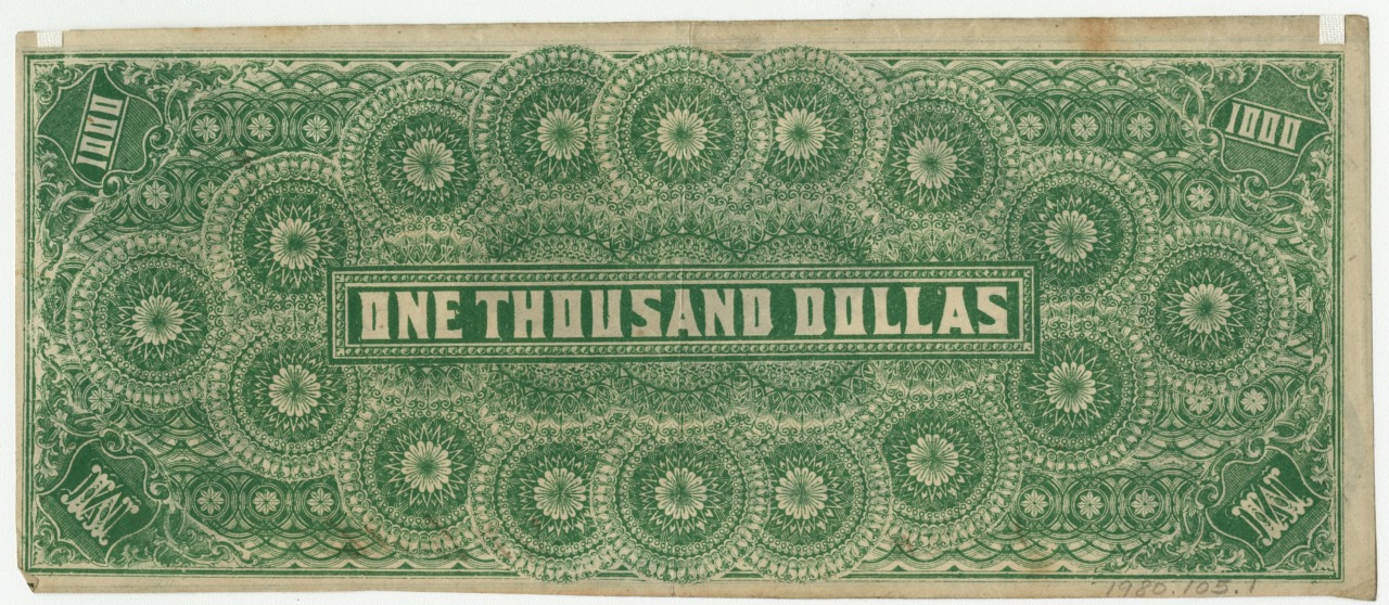 A historic banknote design featuring intricate green patterns and the text ONE THOUSAND DOLLARS prominently displayed in the center. The corners are marked with 1000 in decorative fonts.