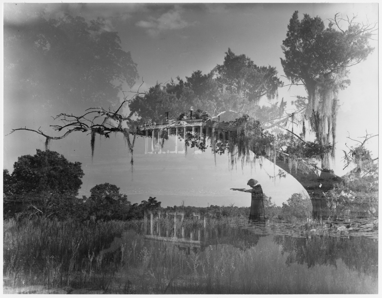 A black and white double exposure image featuring a landscape with trees and a person standing on a path, pointing. The overlay includes a classical building with columns. Moss hangs from the trees, creating an atmospheric effect.