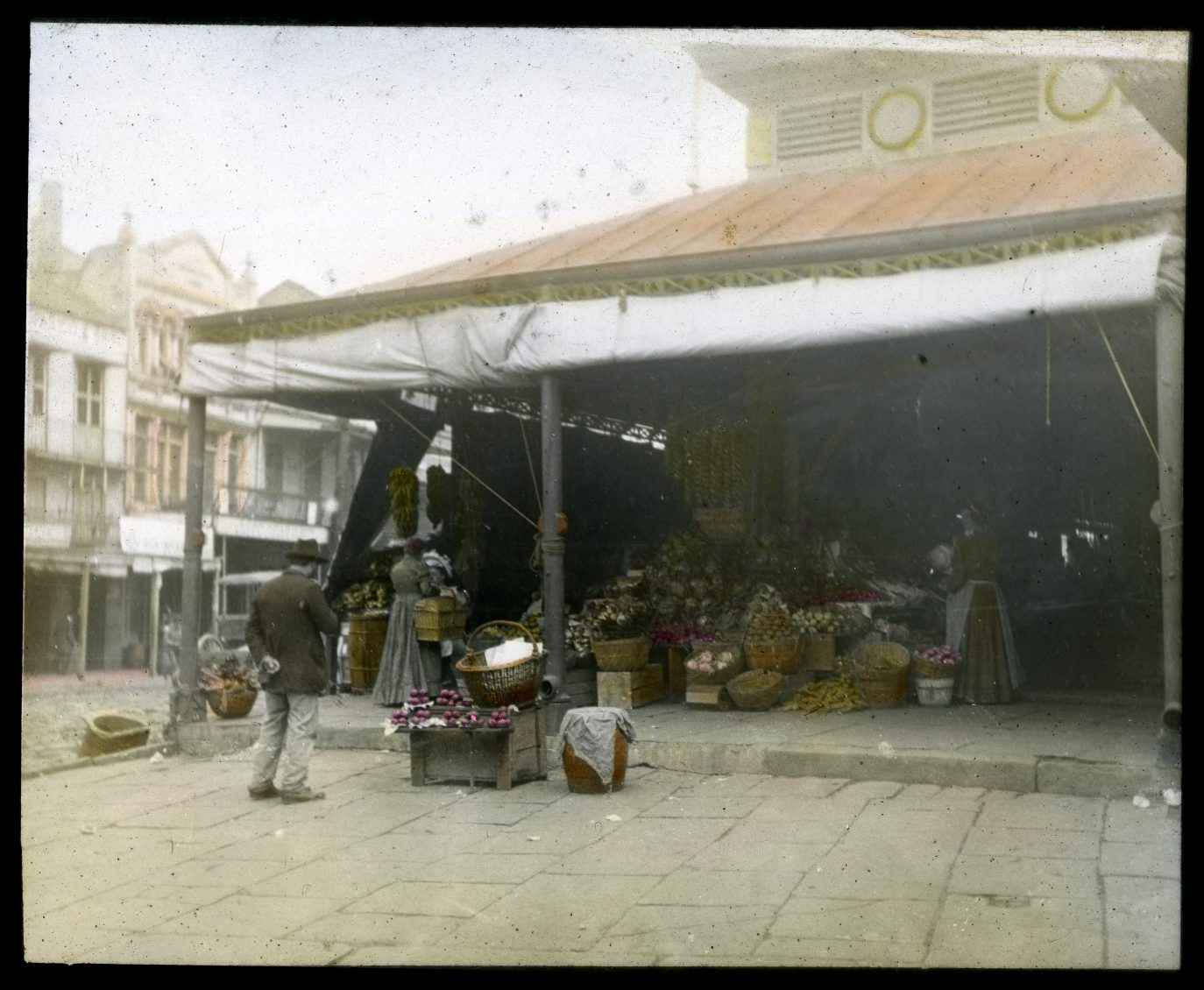 Hand-colored glass slide of vendors at the French Market, between 1885 and 1900.