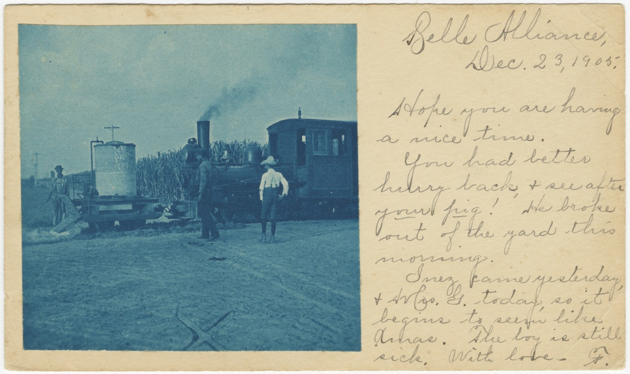 A vintage postcard dated December 23, 1905, from Bella Alliaine, featuring a monochrome photo of a steam locomotive with a man standing nearby. Handwritten text occupies the right side, conveying a personal message.