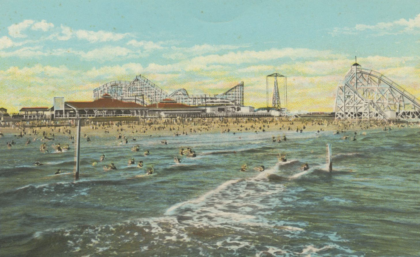 A postcard illustration of Pontchartrain Beach from 1931. Hundreds of people swim on the beach with roller coasters and other amusement park rides visible in the distance.