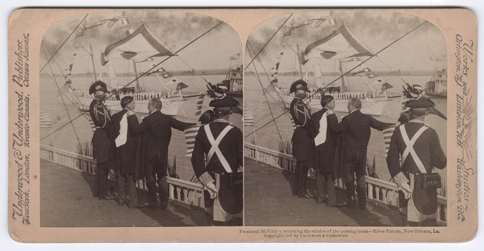 A vintage stereoscopic image shows President McKinley saluting sailors on a passing boat during a parade in New Orleans. He stands on a wooden platform with several officials, and American flags are visible in the background.