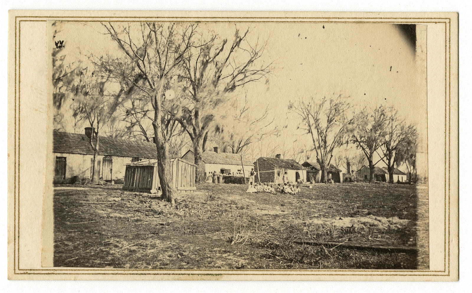 1863 photograph of a plantation and enslaved people, likely in Louisiana.