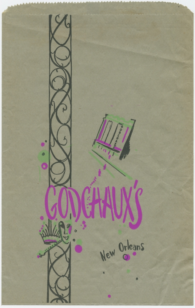 Vintage paper bag from Godchauxs in New Orleans featuring decorative swirls, a comb, and a hand mirror. The text is styled in purple and black.