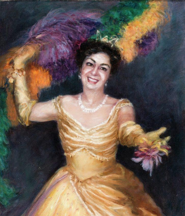 A smiling woman in a yellow dress and long gloves holds colorful feathers. The background is dark, enhancing her bright attire and cheerful expression.