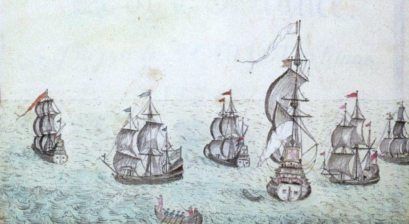 A historical illustration of several sailing ships on the ocean. The ships, with multiple masts and sails, are spread across the water, depicting a naval fleet sailing under clear skies.