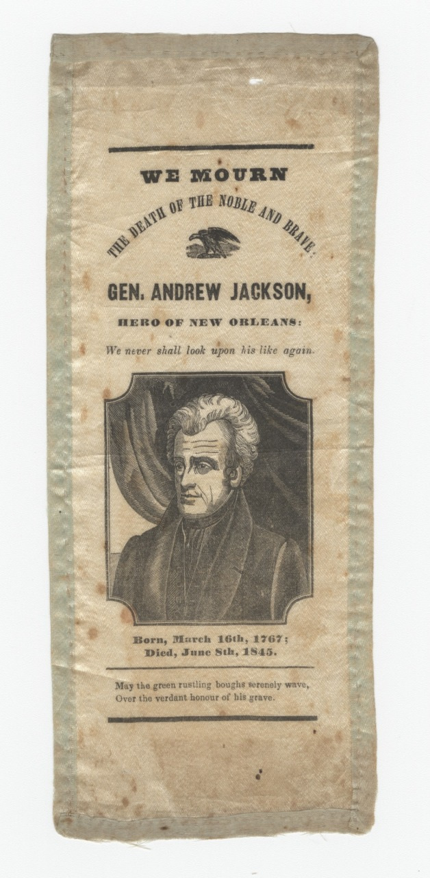 A commemorative ribbon honoring General Andrew Jackson, featuring a portrait. The text reads: We mourn the death of the noble and brave Gen. Andrew Jackson, hero of New Orleans. We never shall look upon his like again. Birth and death dates are included.
