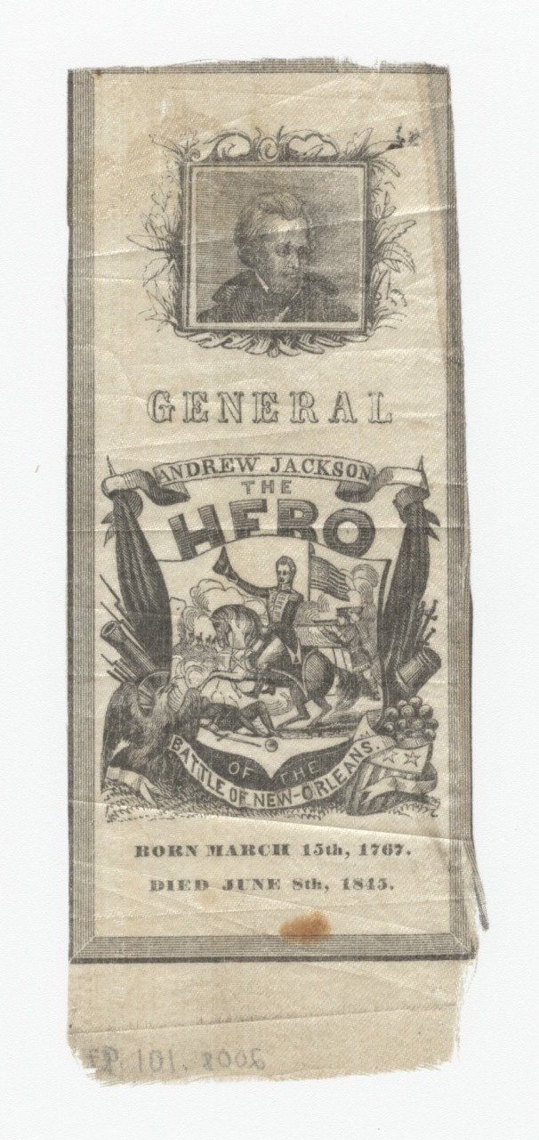 An old printed textile commemorating General Andrew Jackson. It features a portrait at the top and an illustration of the Battle of New Orleans in the center. Text includes The Hero and dates Born March 15th, 1767. Died June 8th, 1845.