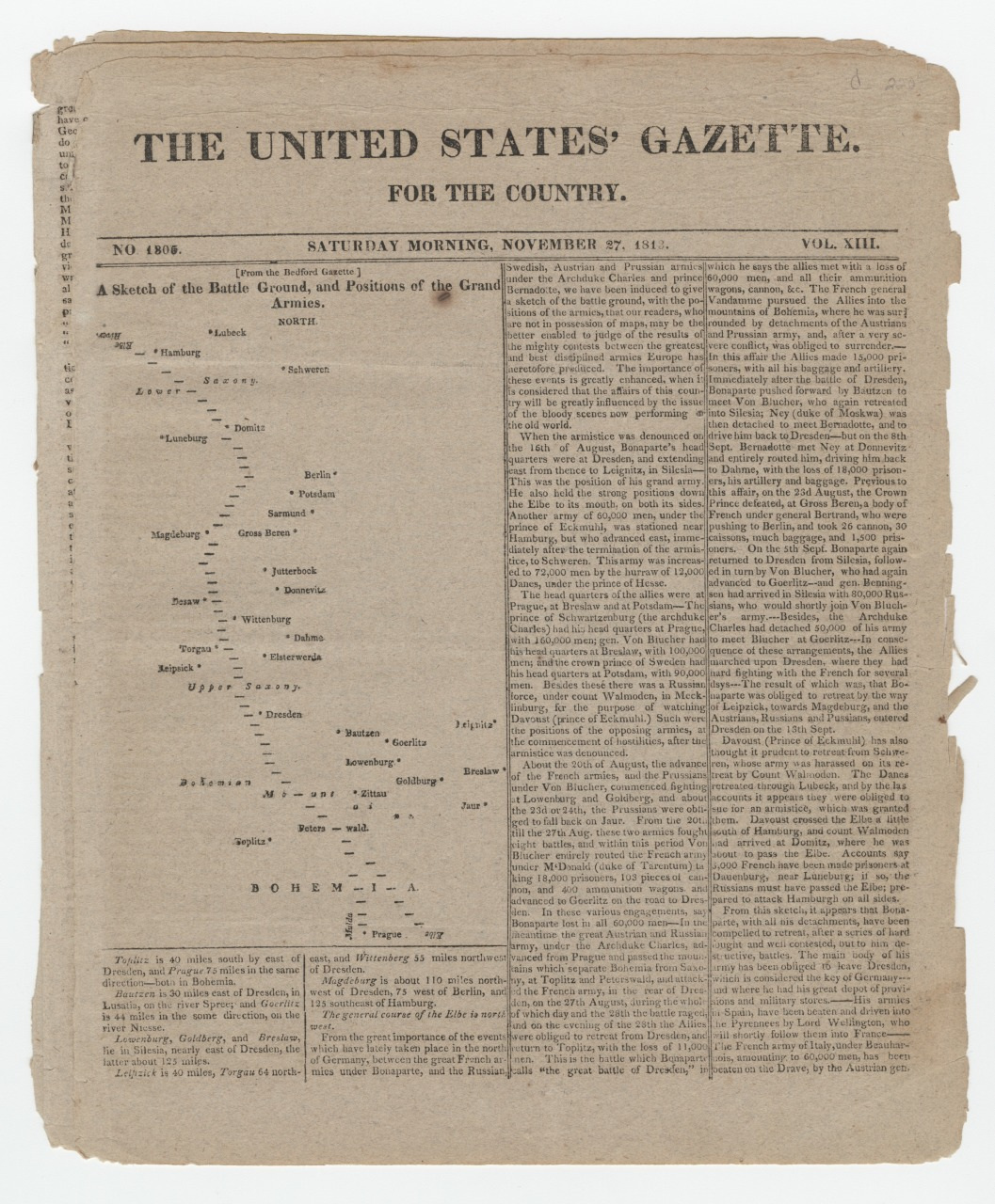 A vintage newspaper page from The United States Gazette for the Country dated November 27, 1813. It includes articles and a map sketch of battle grounds with positional details of the grand armies in Europe. The page is aged and worn.