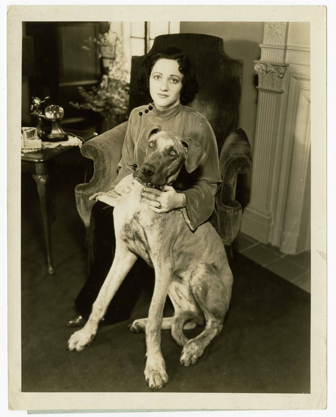 Connie Boswell posing with a Great Dane in 1933.