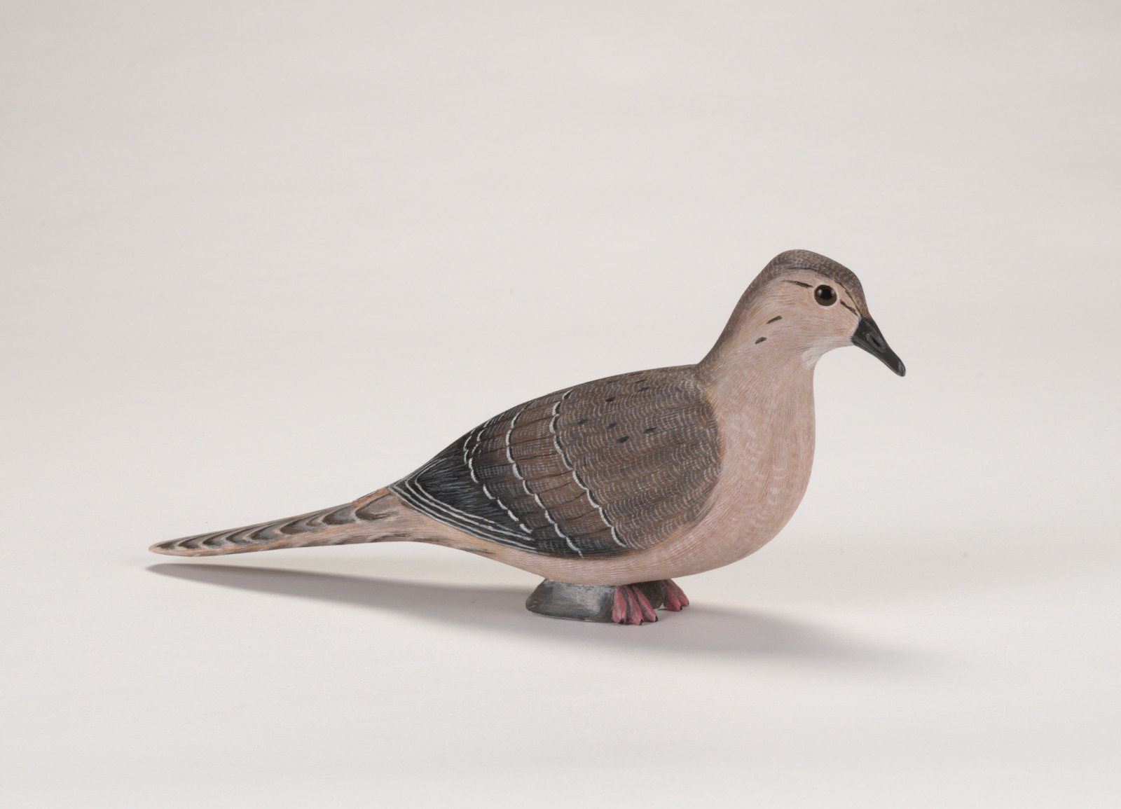 A realistic carving of a dove.