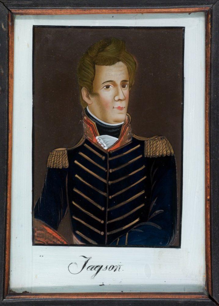 A framed painting of a man in a historical military uniform with decorative shoulder epaulettes and detailed embroidery on the jacket. The portrait includes a name written below.