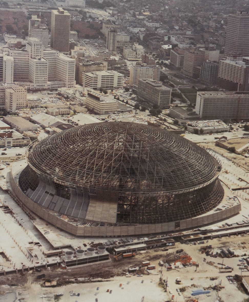 An aerial photo from 1975 shows the steel framework of the Superdome.