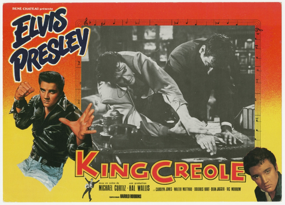 Retro movie poster for King Creole featuring a collage of images: Elvis Presley in two poses, one in a leather jacket and another in a dramatic action scene, with a vibrant red and yellow gradient background and bold text.