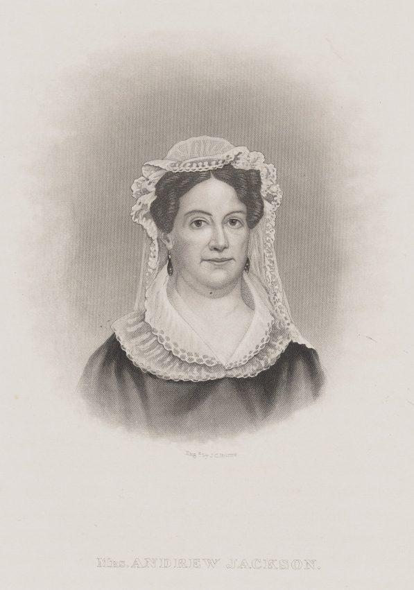 A historical black-and-white portrait of a woman wearing a lace bonnet and a dark dress with lace trim. She has a calm expression and is facing forward. The text below reads Mrs. Andrew Jackson.
