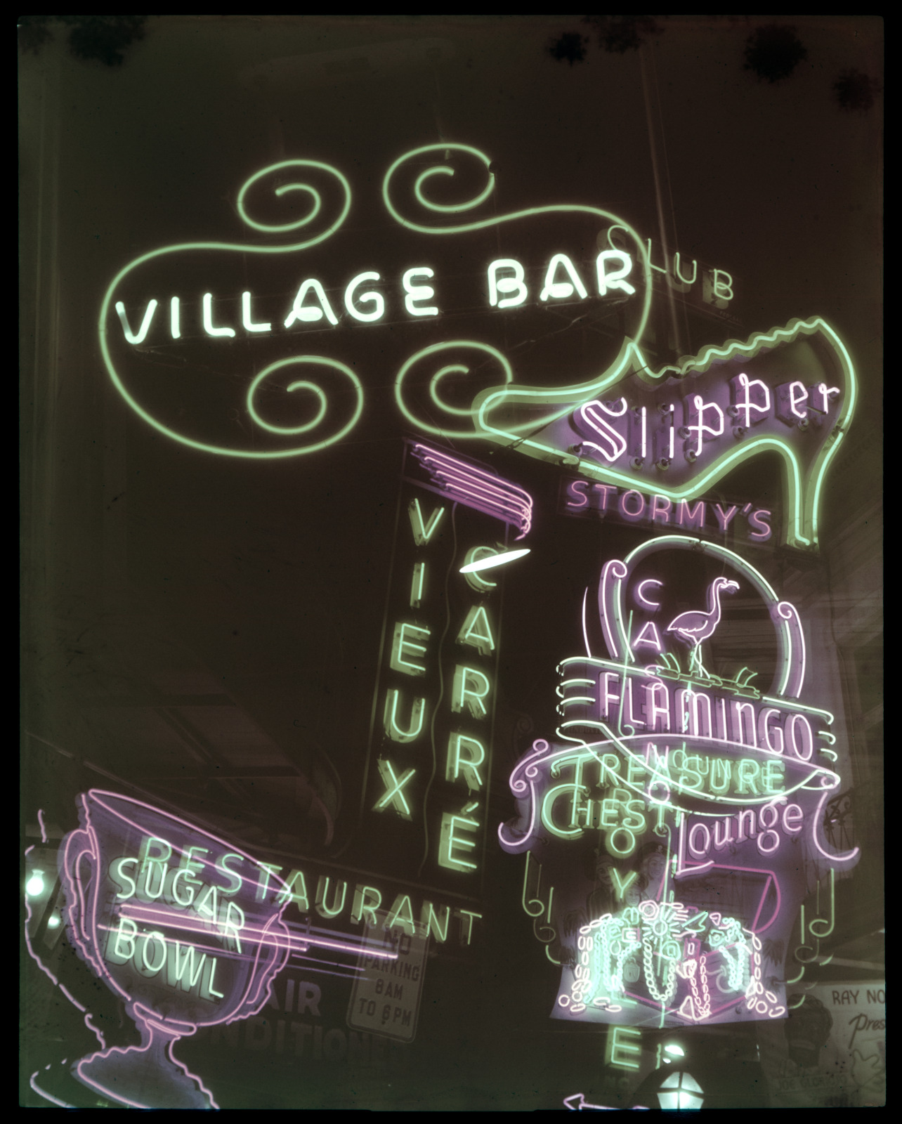 Double-exposure view of neon signs along Bourbon Street, 1948.
