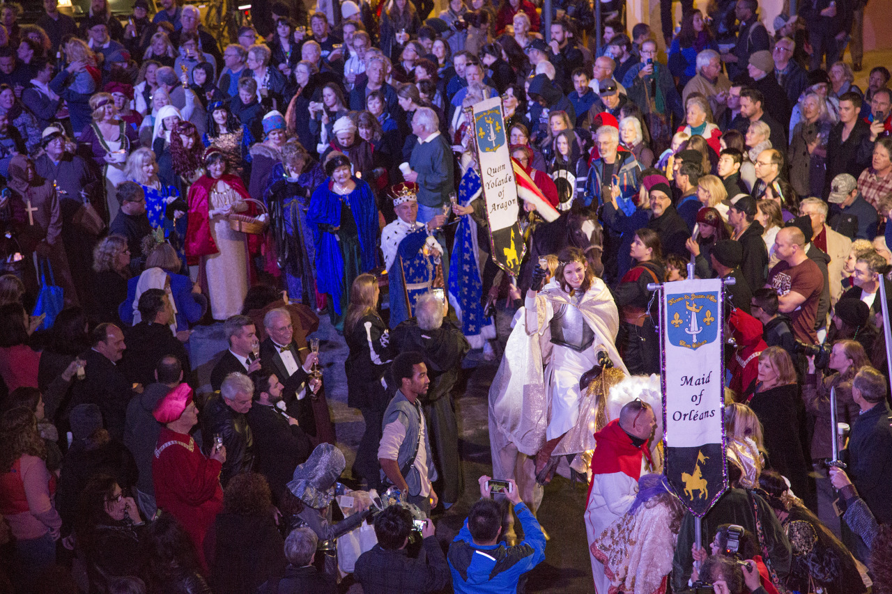 Members of the Krewe of Jeanne d’Arc proceed through the French Quarter on January 6, 2016.