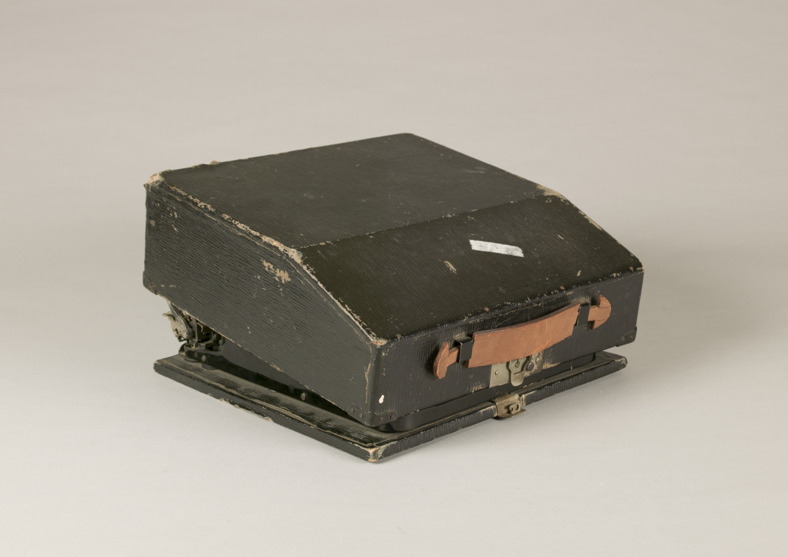 A photo of Tennessee Williams’s Remington typewriter used while writing "A Streetcar Named Desire," enclosed in its dark grey case, equipped with a carry handle.