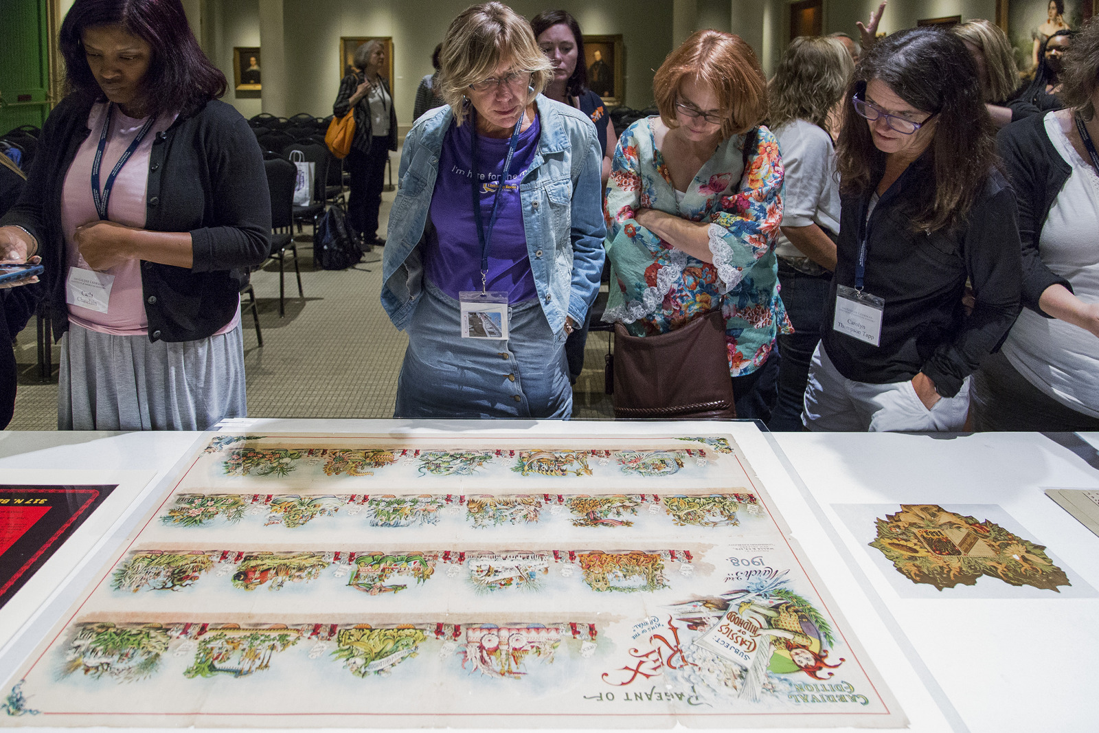 A group of educators viewing historic objects at an educator workshop hosted by the Historic New Orleans Collection.