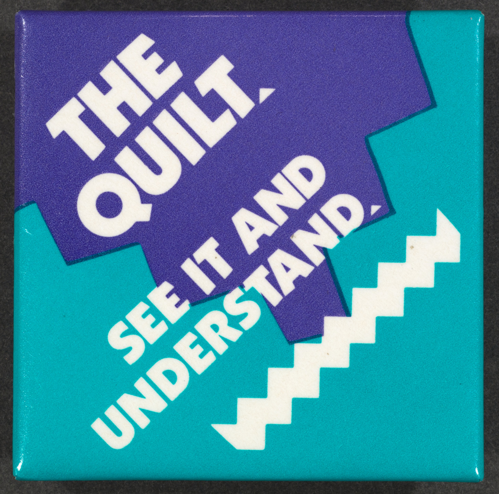 A purple and teal square graphic with bold white text. The top reads THE QUILT, and the bottom says SEE IT AND UNDERSTAND. A jagged white line separates the two sections.