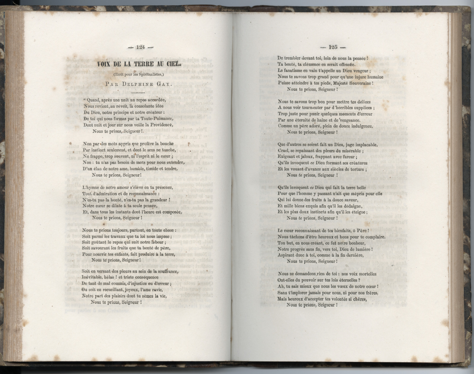 A page of the book is opened to “Voix de la terre au ciel” (Voice from the earth to the heavens), a poem by Delphine Gay.