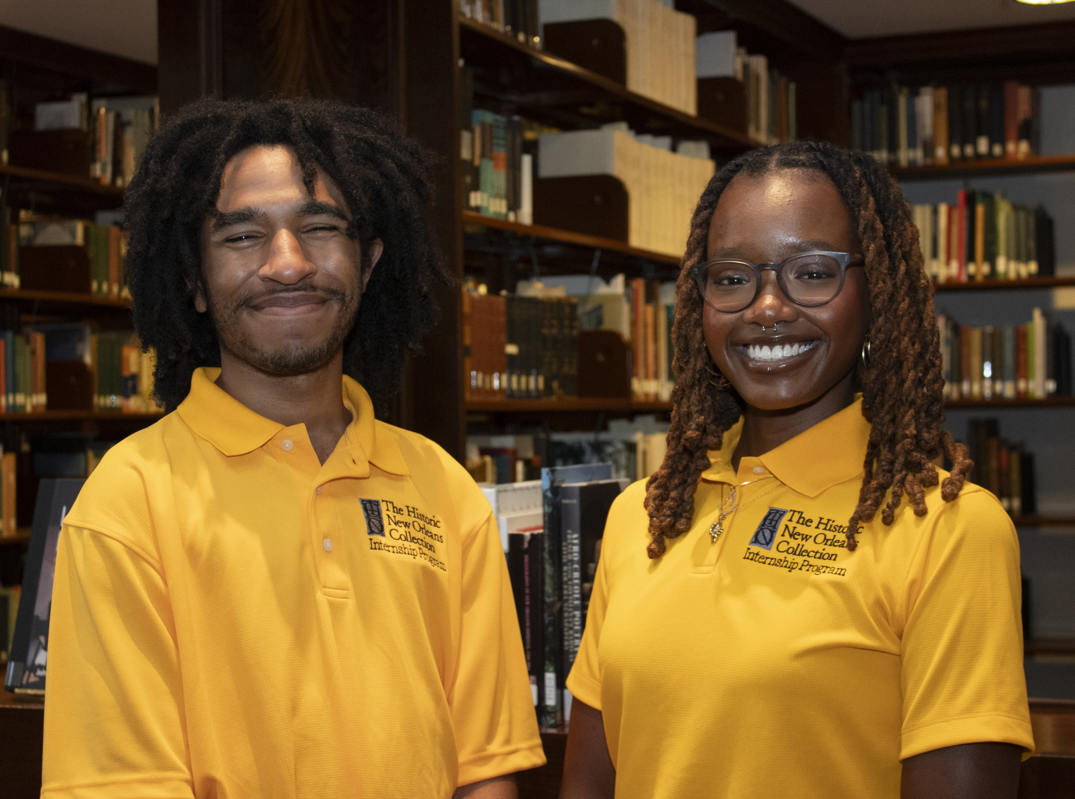 Cederick Ellis (left) and Jasmine Christopher (right) pose for a photo at HNOC's Williams Research Center Reading Room.